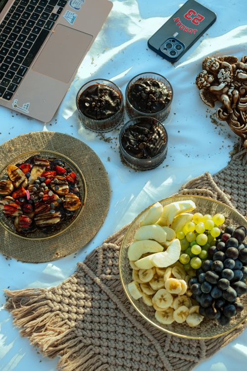 Free Top-down view of a nutritious breakfast with fresh fruits and chocolate on a beautifully arranged table. Stock Photo