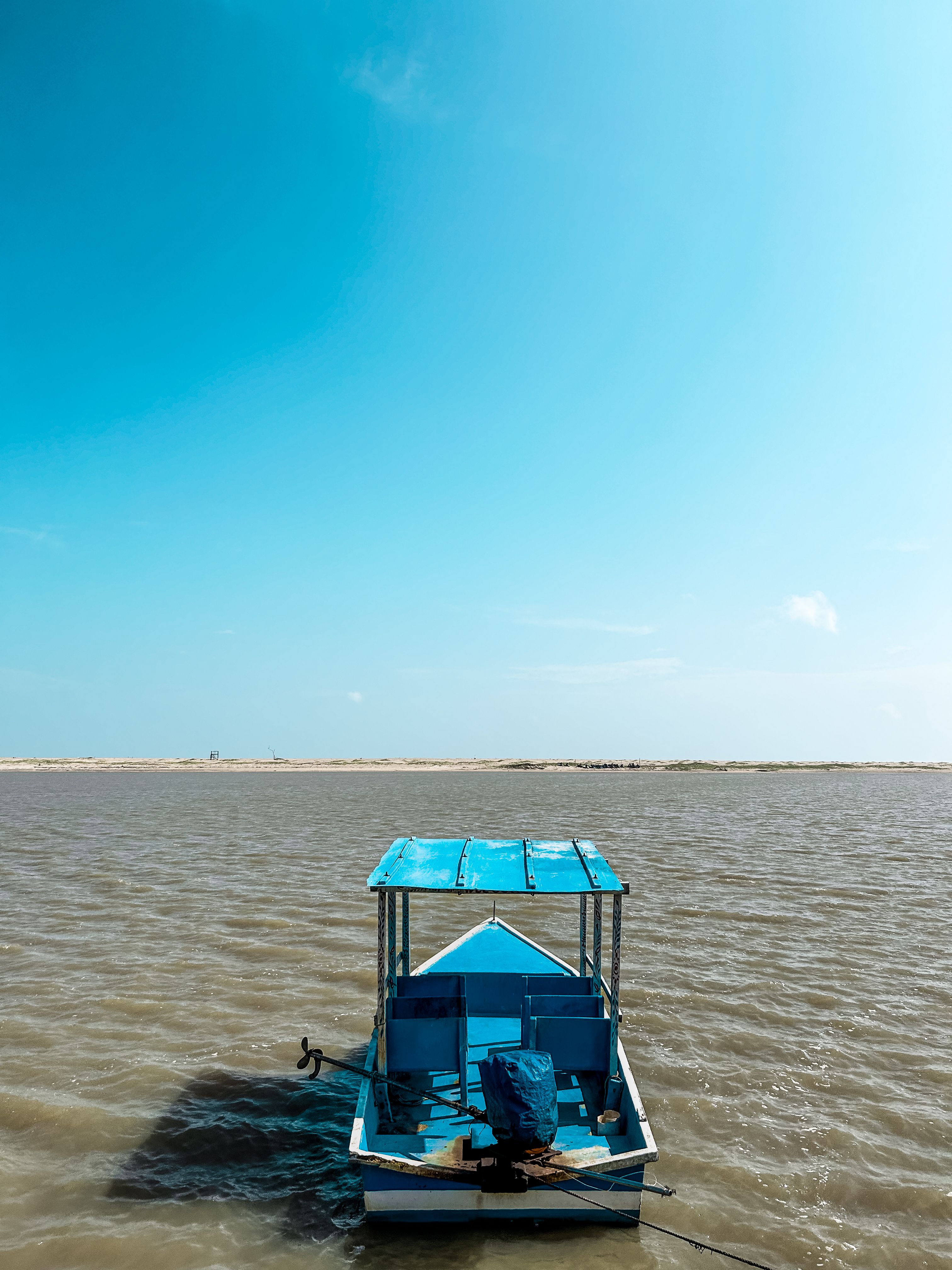 A boat in the middle of a body of water · Free Stock Photo