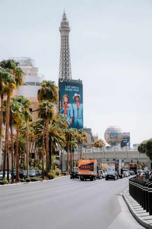 Free Vibrant view of the Las Vegas Strip featuring the Eiffel Tower replica and bustling city life. Stock Photo