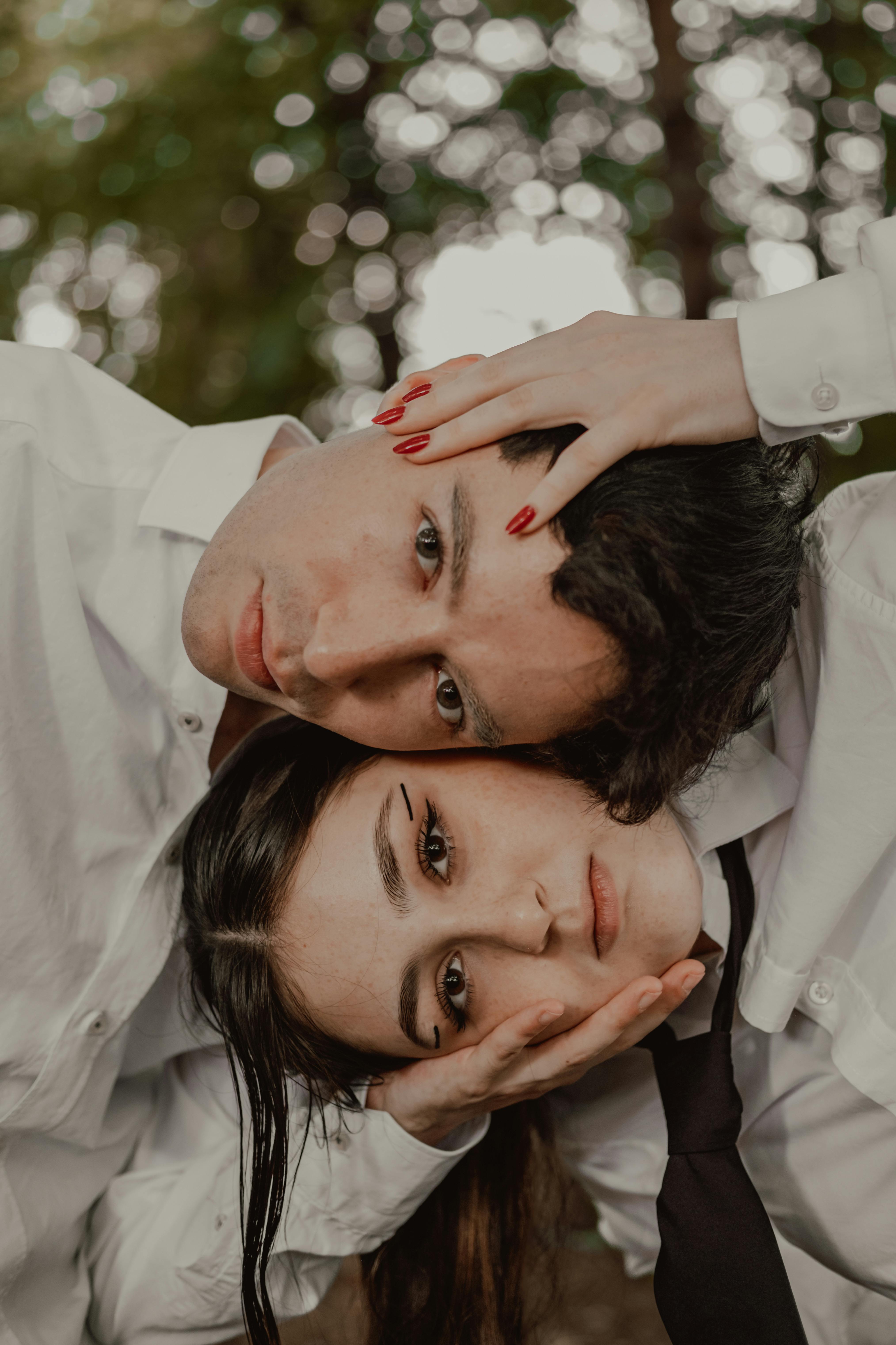 a man and woman are posing for a photo