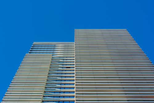 Free Striking view of a contemporary skyscraper facade in Den Haag, featuring glass and steel architecture. Stock Photo