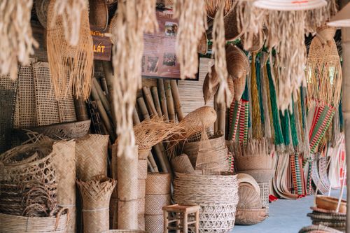 Free Collection of traditional handmade wicker baskets on display at a rural market. Stock Photo