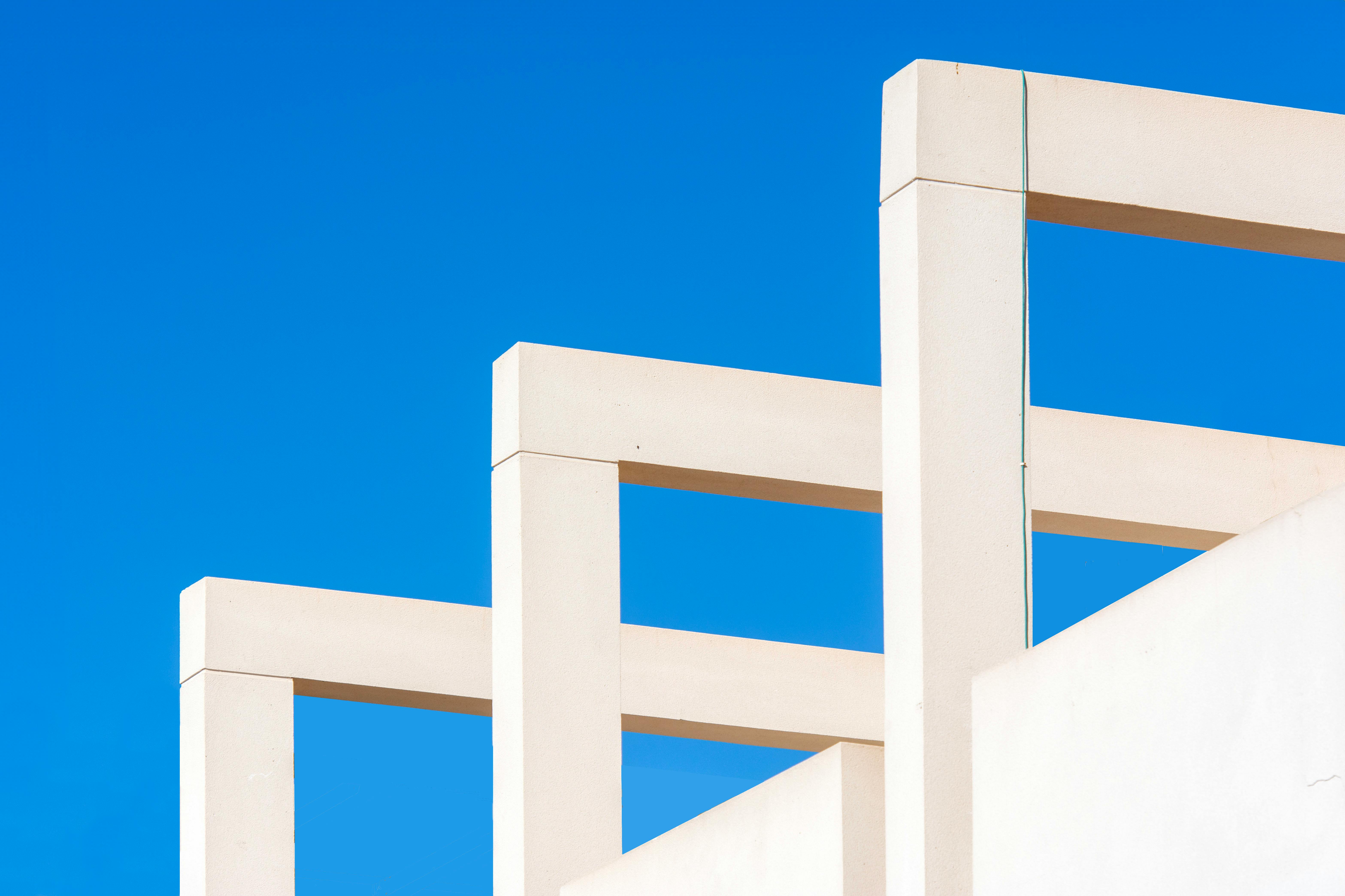 a close up of a white building with blue sky