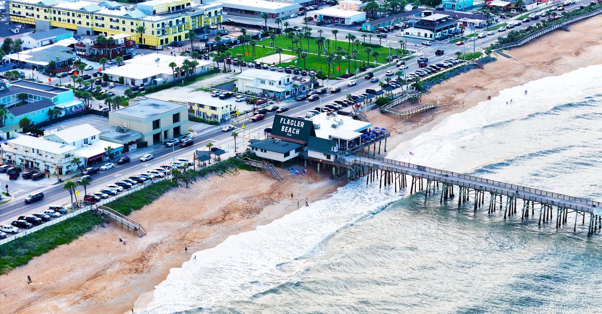 Aerial view of Flagler Beach, FL showcasing the pier and coastline.
