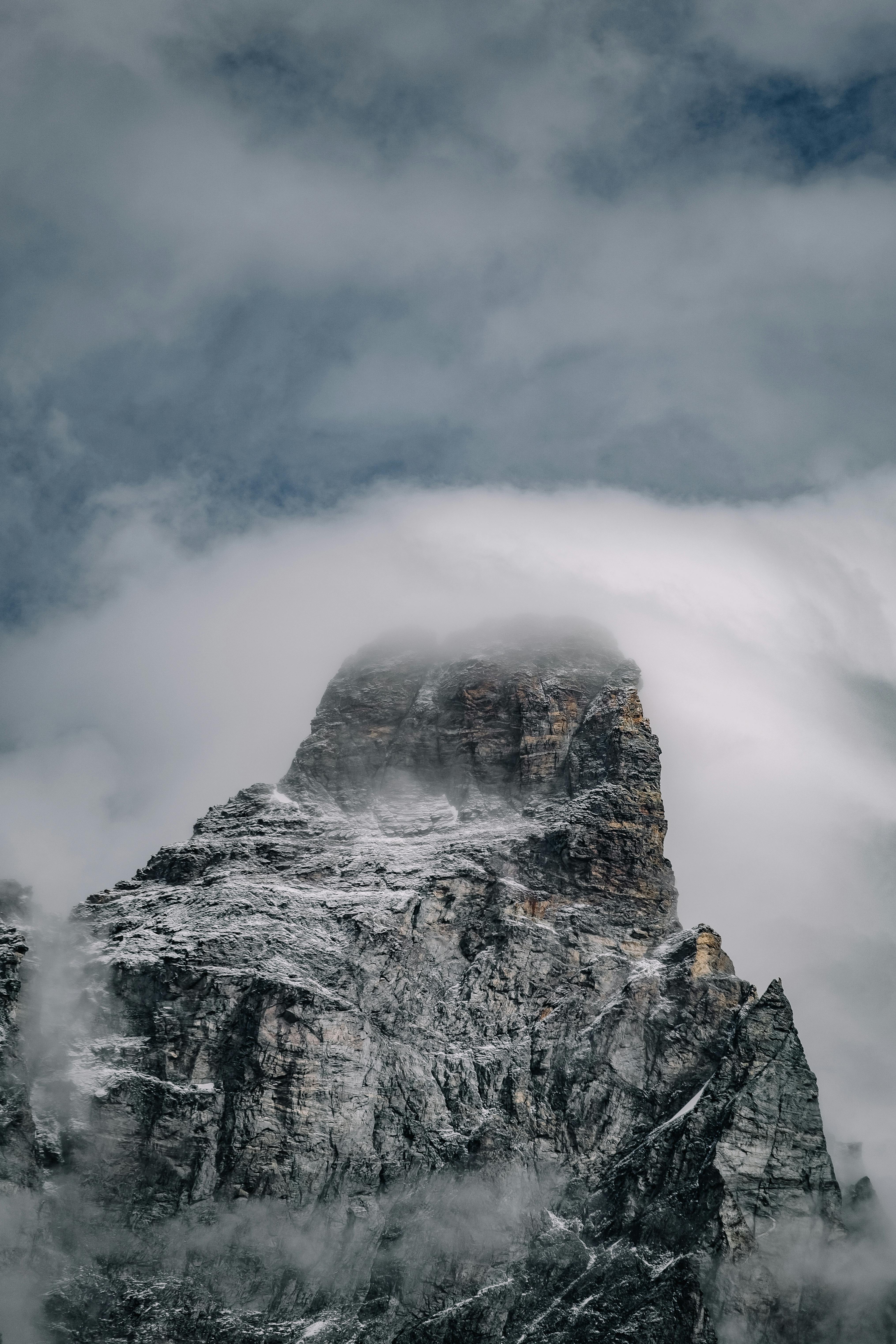 Prescription Goggle Inserts - Snow-covered mountain peak shrouded in mist, creating a dramatic and serene landscape.