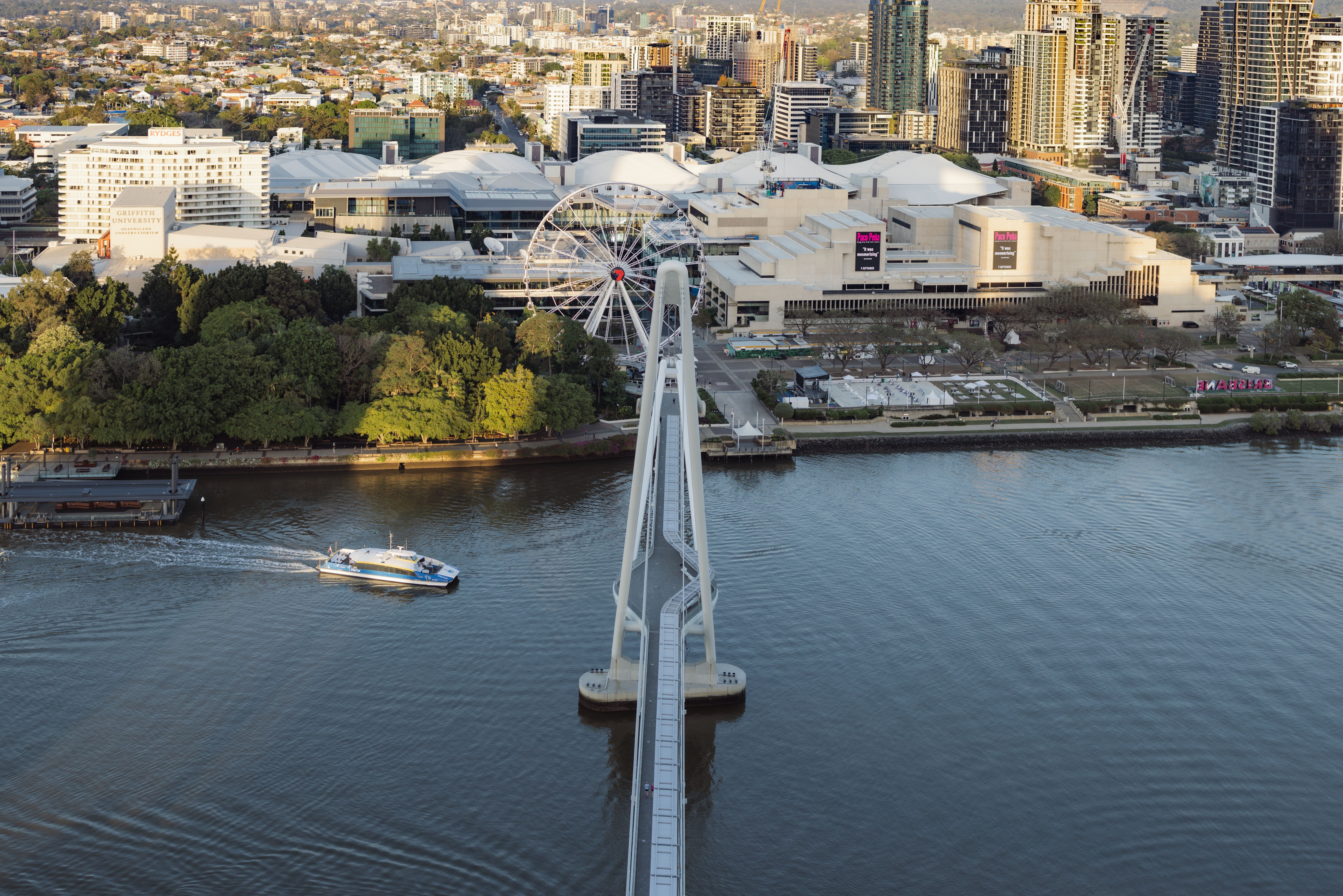 An aerial view of a city with a ferris wheel · Free Stock Photo