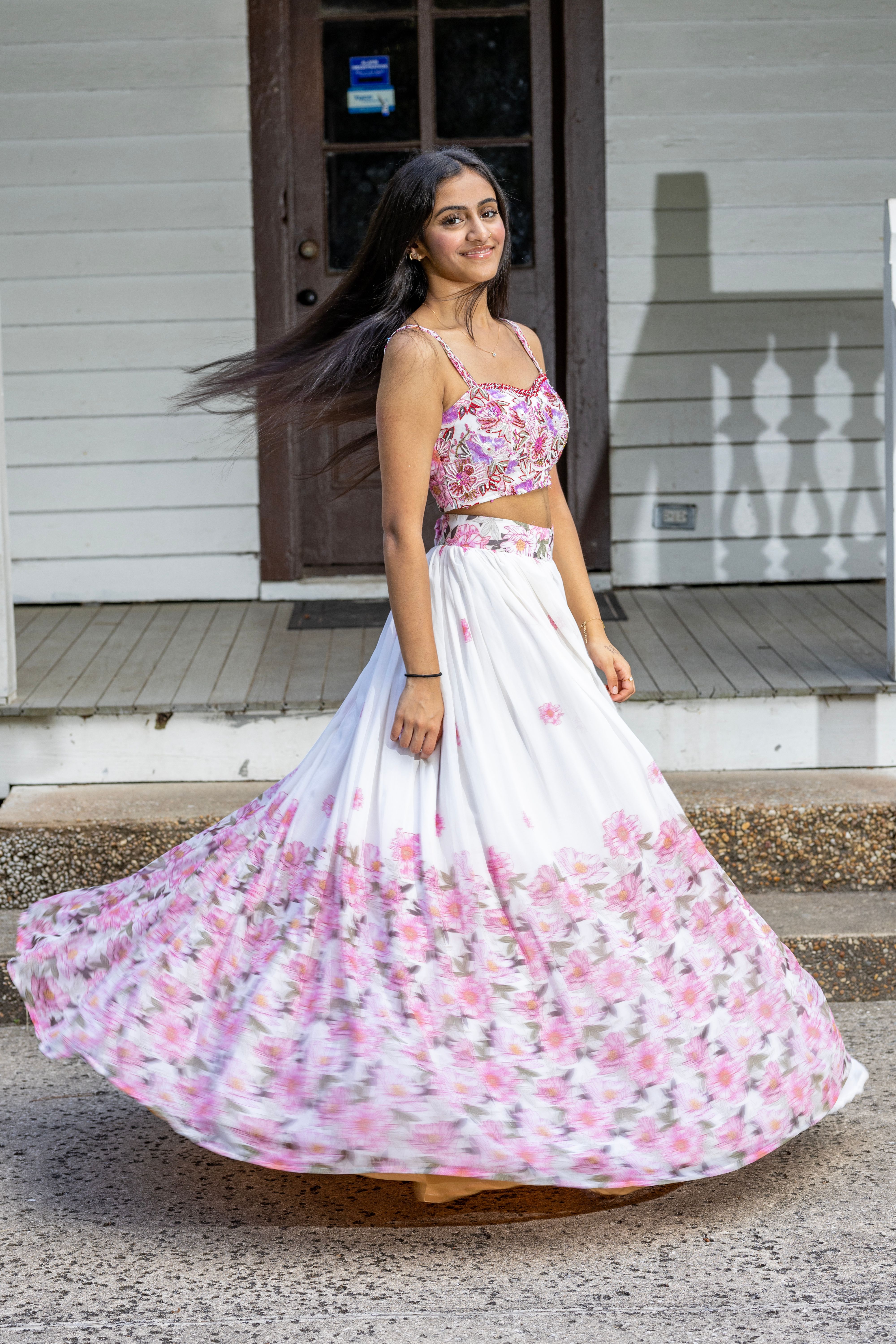 A woman in a pink and white floral dress · Free Stock Photo