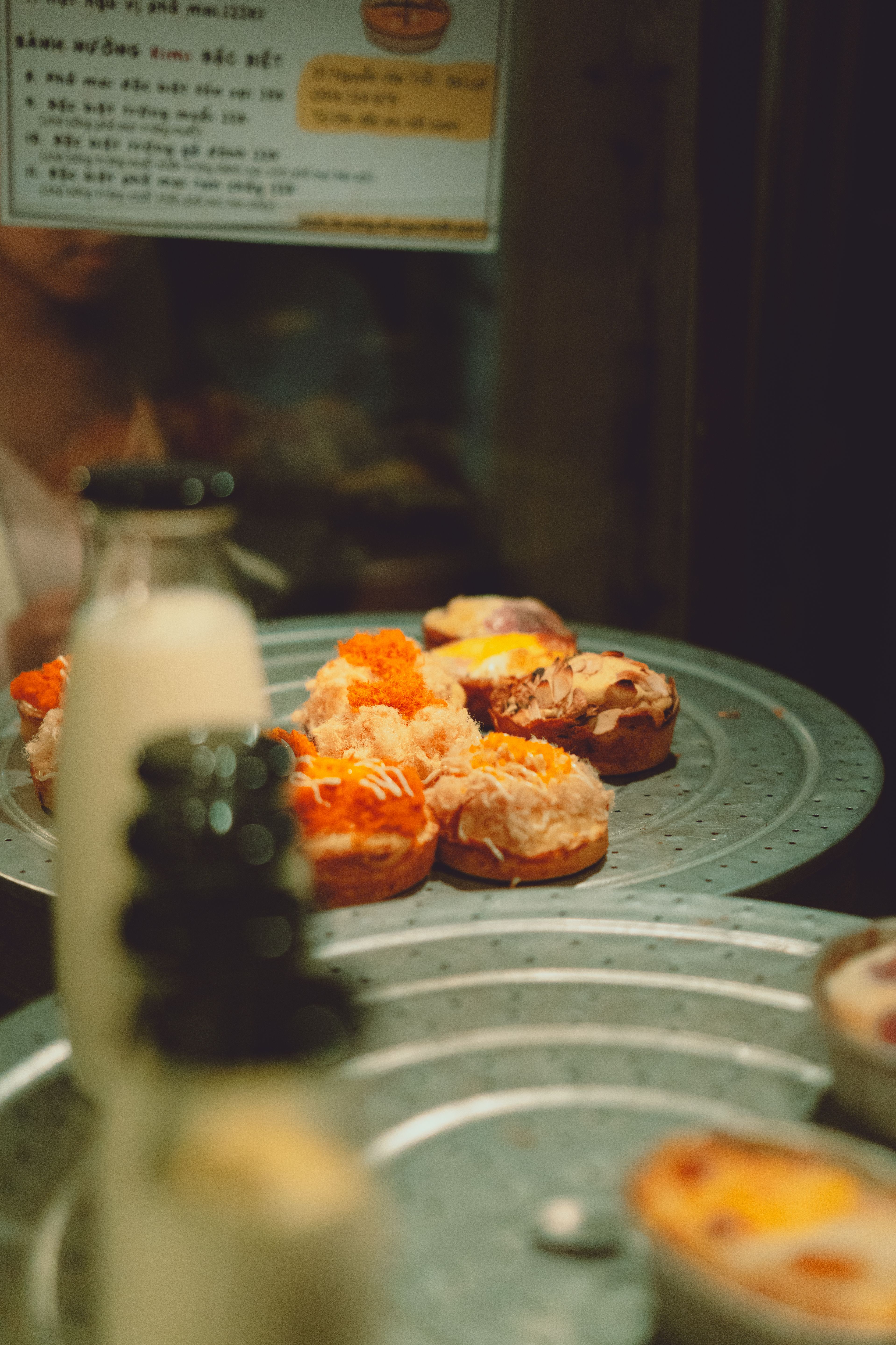 Delicious Vietnamese pastries displayed in a Dalat café, evoking a cozy dining atmosphere.