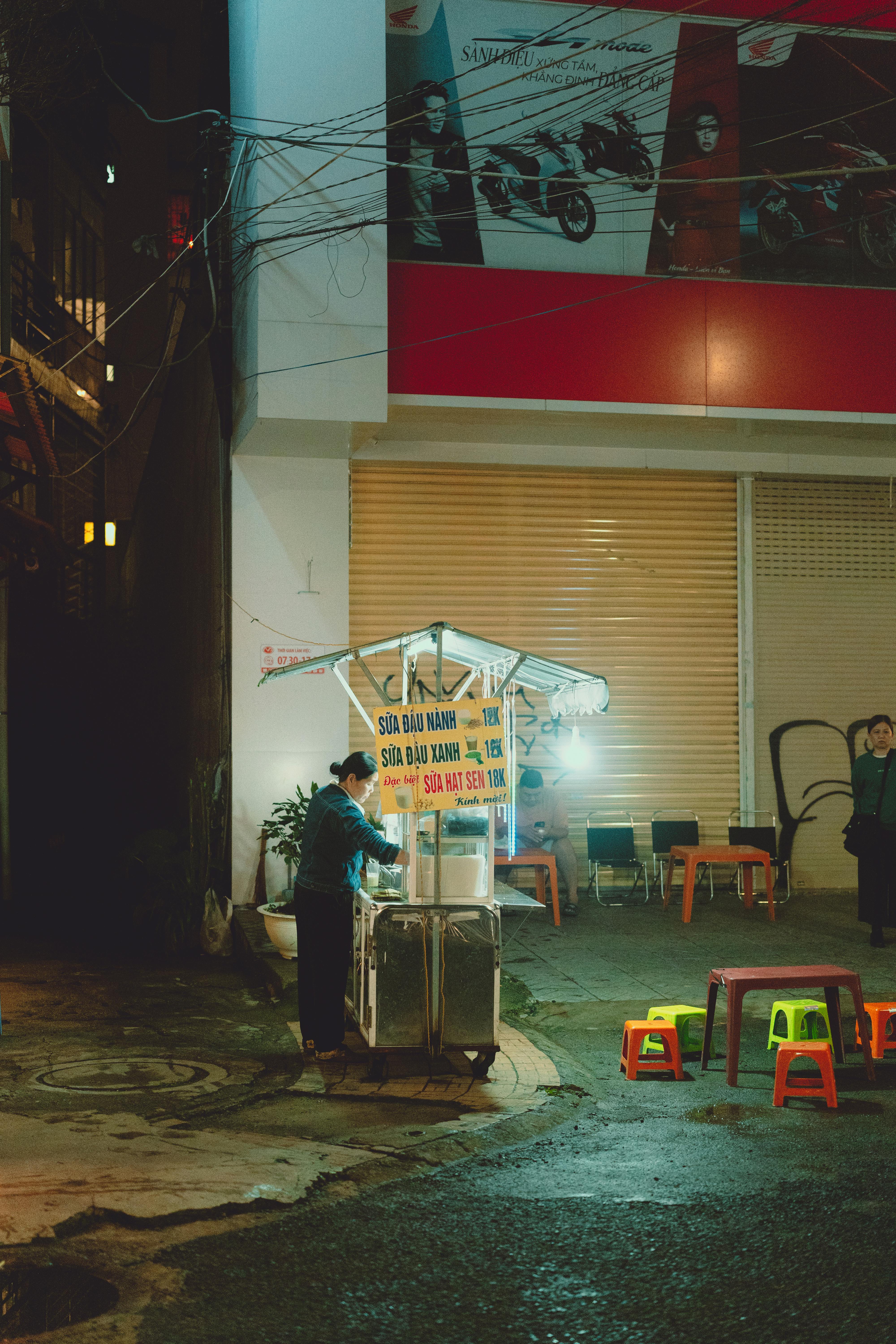 a man standing in front of a street light