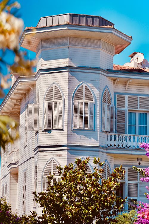 Free Explore the intricate beauty of a classic Ottoman-style home with unique shuttered windows in Istanbul, Turkey. Stock Photo