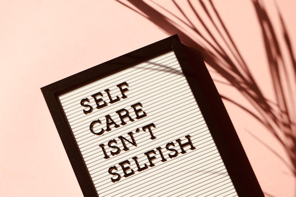 letter board with the words "self care isn't selfish"