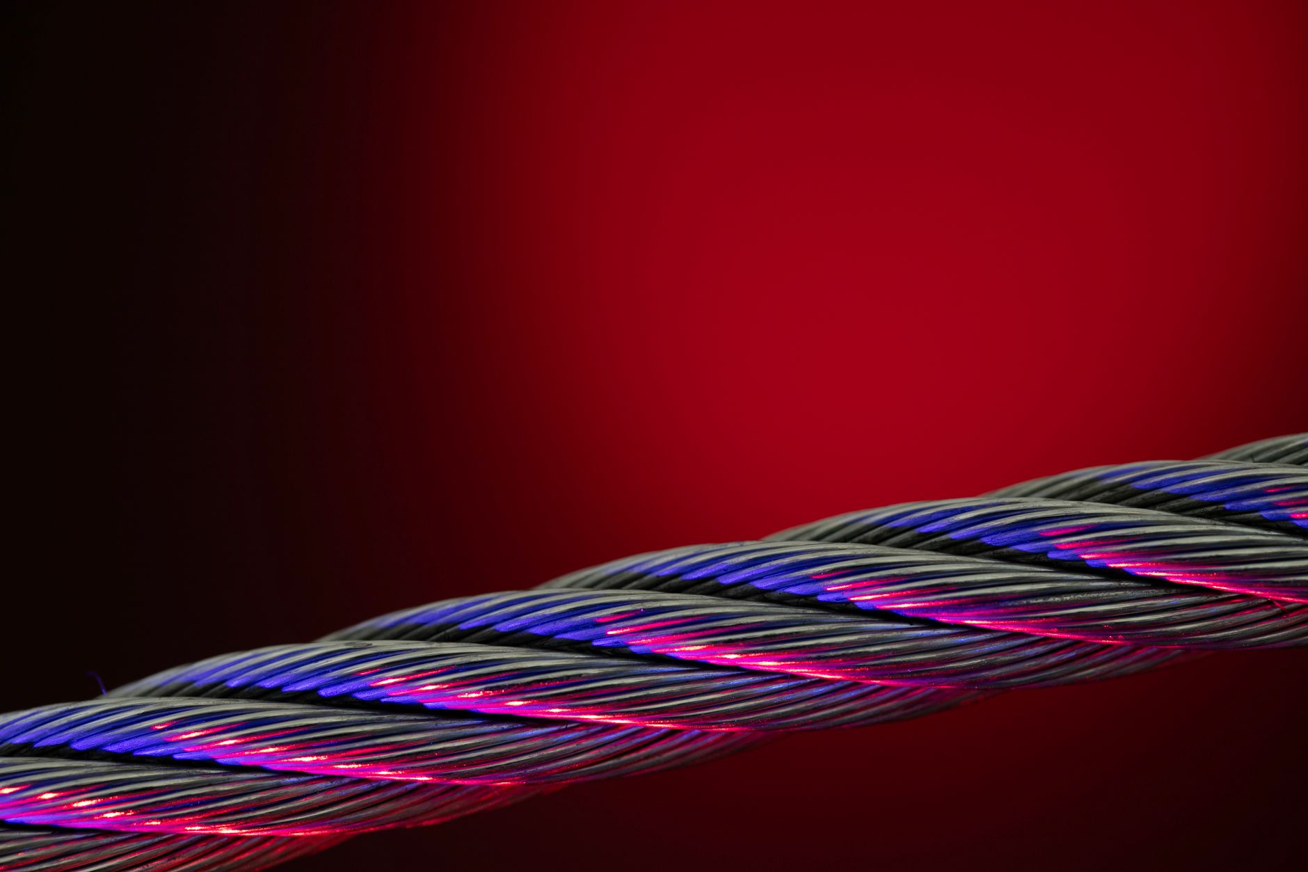 fiber optic cable glowing blue close up