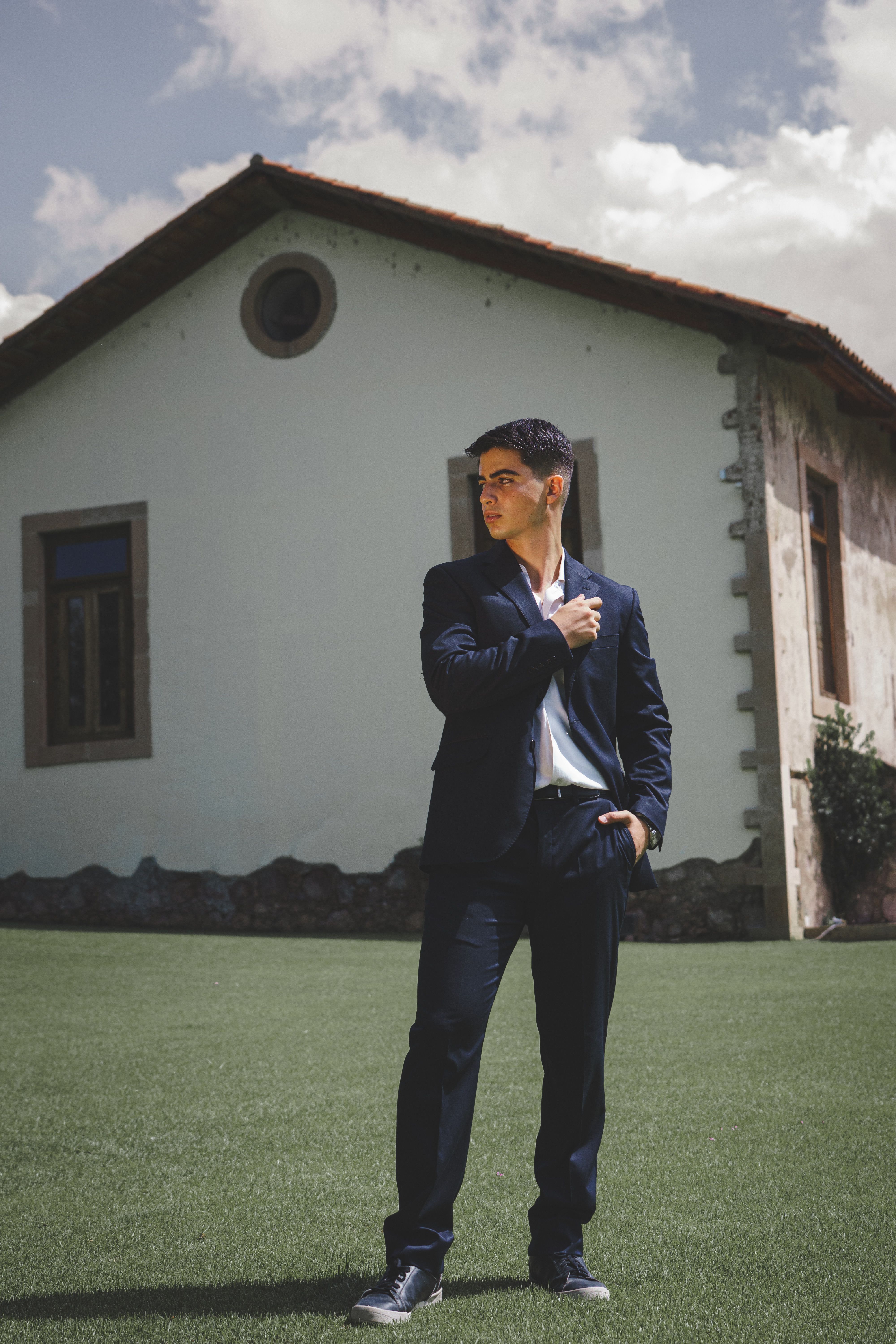 Player standing on a sunlit lawn — photo by Core Cordova on Pexels