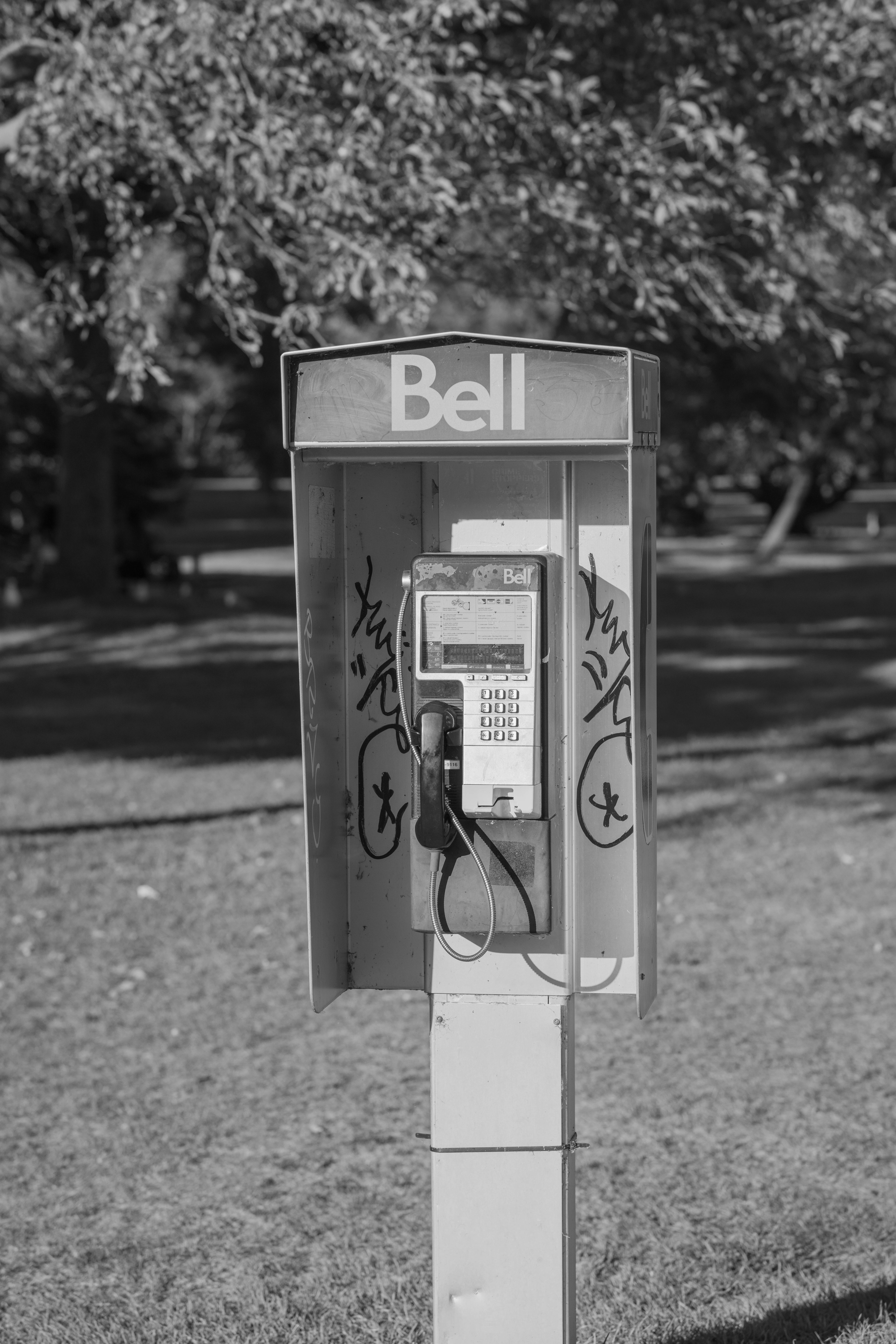 Grayscale Photo of a Phone Booth · Free Stock Photo