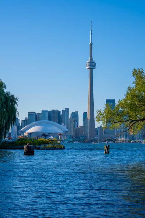 Free Stunning view of Toronto skyline with iconic CN Tower on a sunny day. Stock Photo