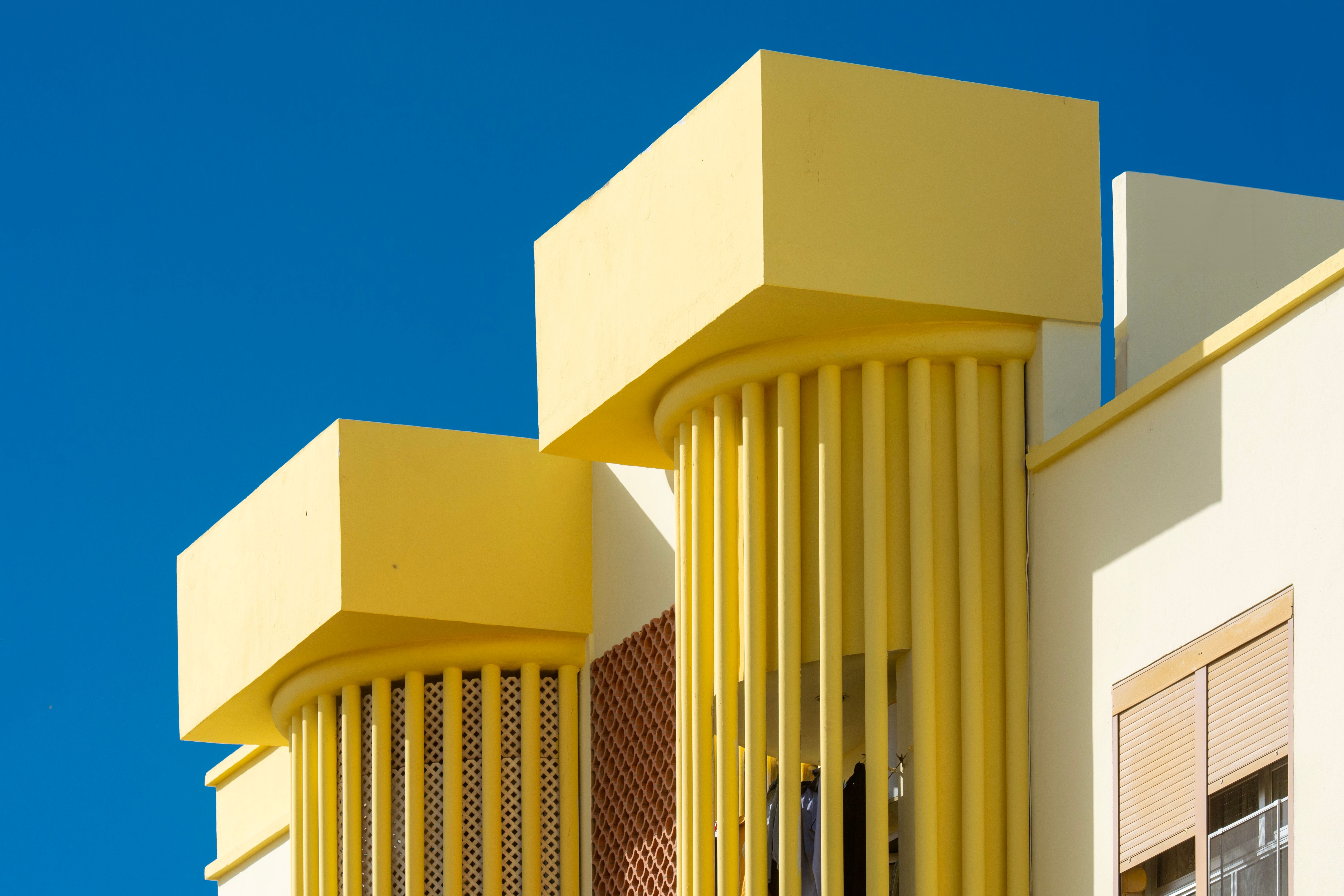 Yellow Modern Columns on Facade · Free Stock Photo