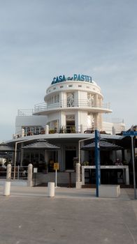 Stunning Art Deco styled building by the sea, under a bright summer sky.