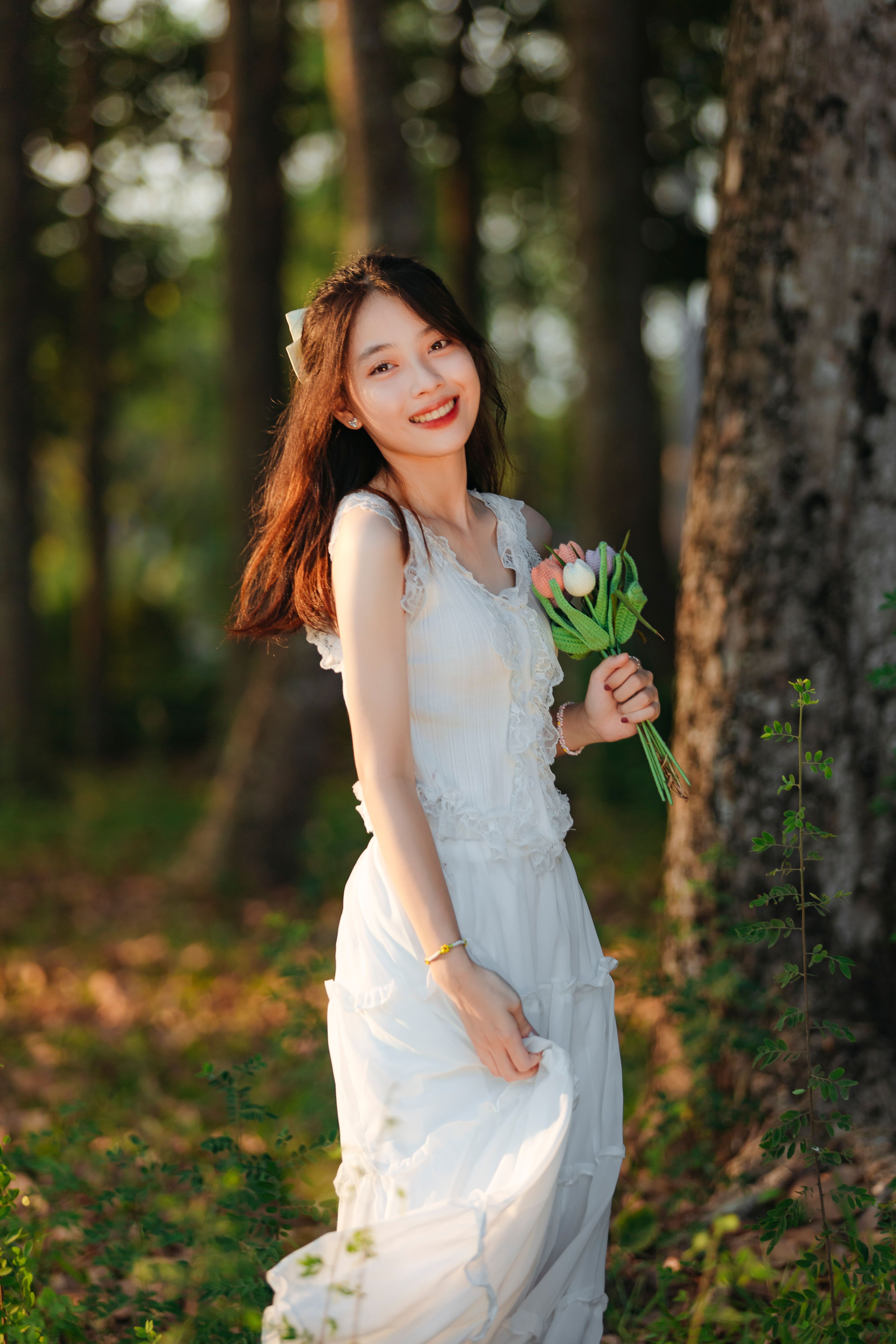 Woman in Dress Standing Beside Tree · Free Stock Photo