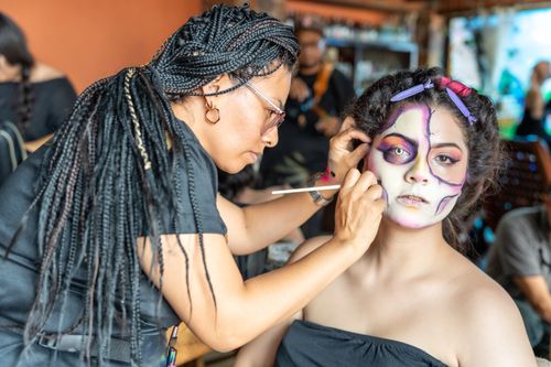 Free Artist applying face paint for Day of the Dead celebration in Mexico City, CDMX. Stock Photo