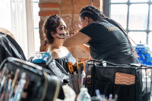 Makeup artist prepares a woman for Dia de Muertos with a sugar skull design in Mexico City.