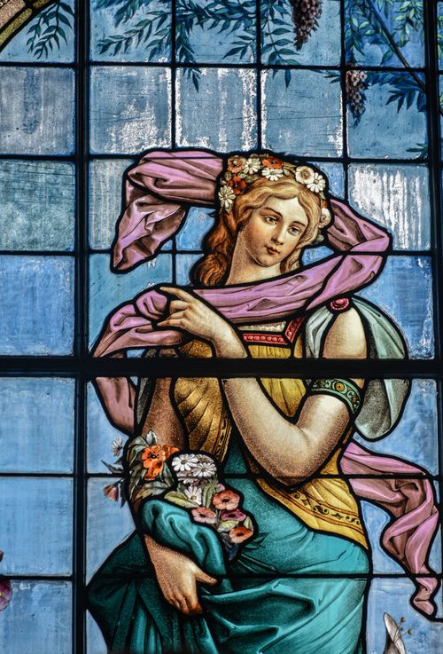 Free Vibrant stained glass window depicting a woman in Ciudad de México, rich with artistic and religious symbolism. Stock Photo