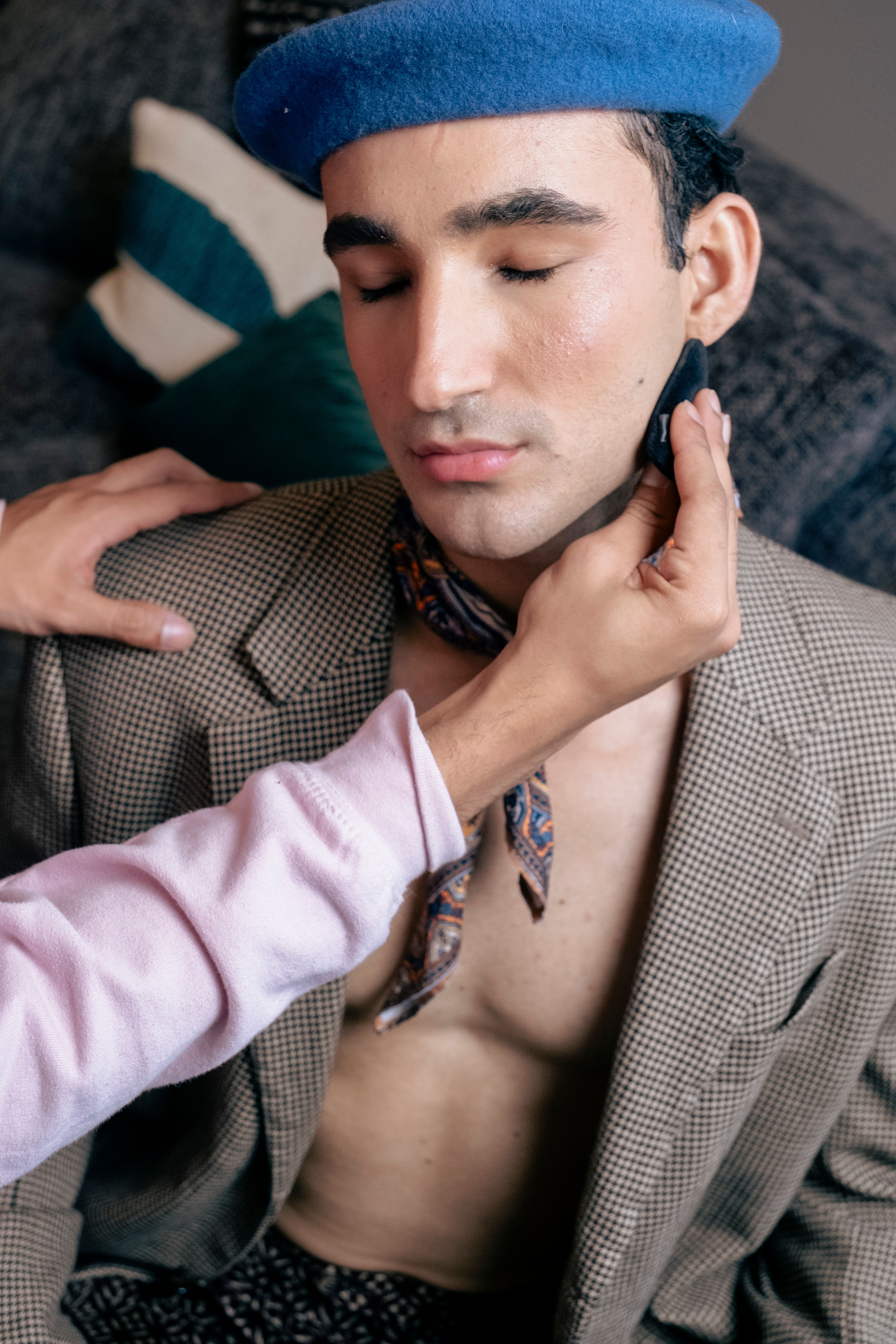 Hands Touching Man in Blue Hat and Jacket · Free Stock Photo