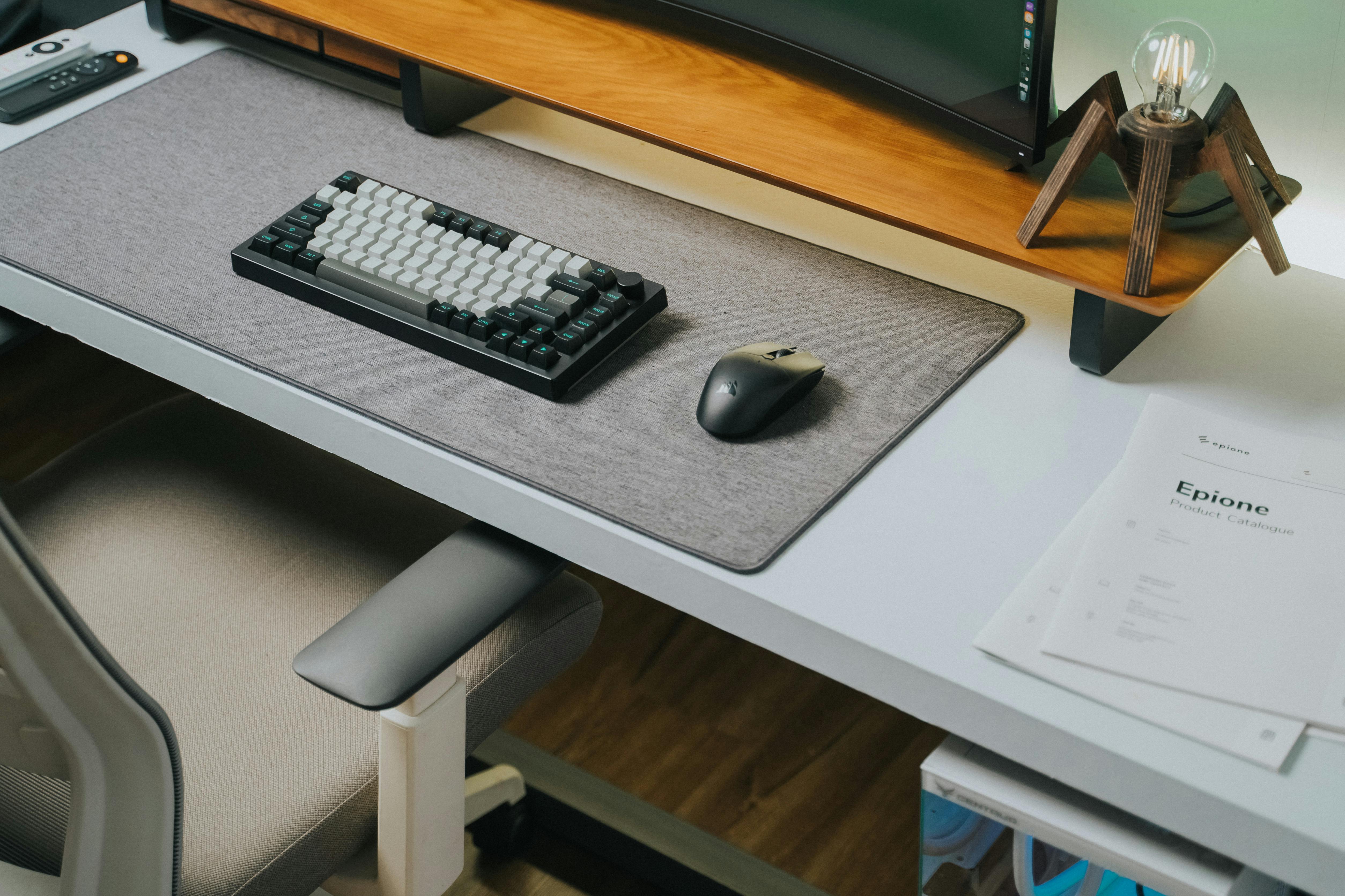 a desk with a keyboard and mouse on it