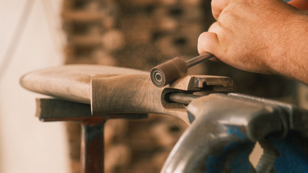 Master artisan shaping wood on a lathe