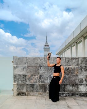 A fashionable portrait on a rooftop with Torre Latinoamericana in the background in Mexico City.