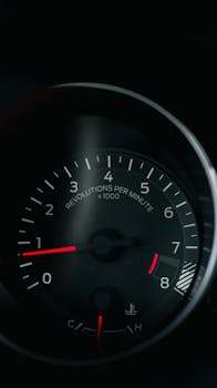 Close-up of a vehicle's RPM gauge showing revolutions per minute, highlighting performance.
