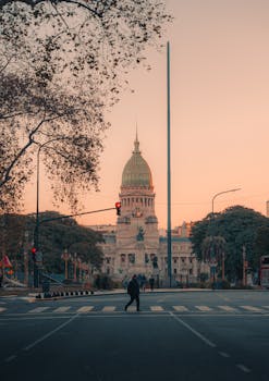 A stunning view of Buenos Aires Congress building in the golden hour, captured from a crosswalk.