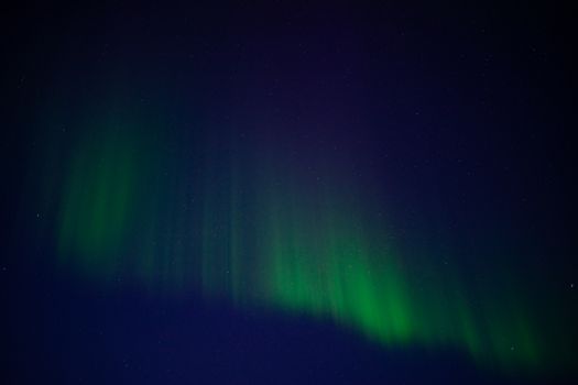 Stunning display of the Aurora Borealis lights up the night sky in Karasjok, Finnmark, Norway. Perfect for travel enthusiasts.