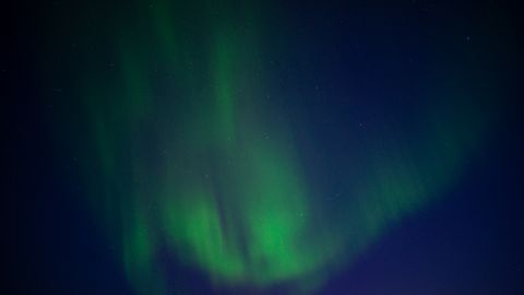 Stunning Aurora Borealis illuminating the night sky in Karasjok, Norway.