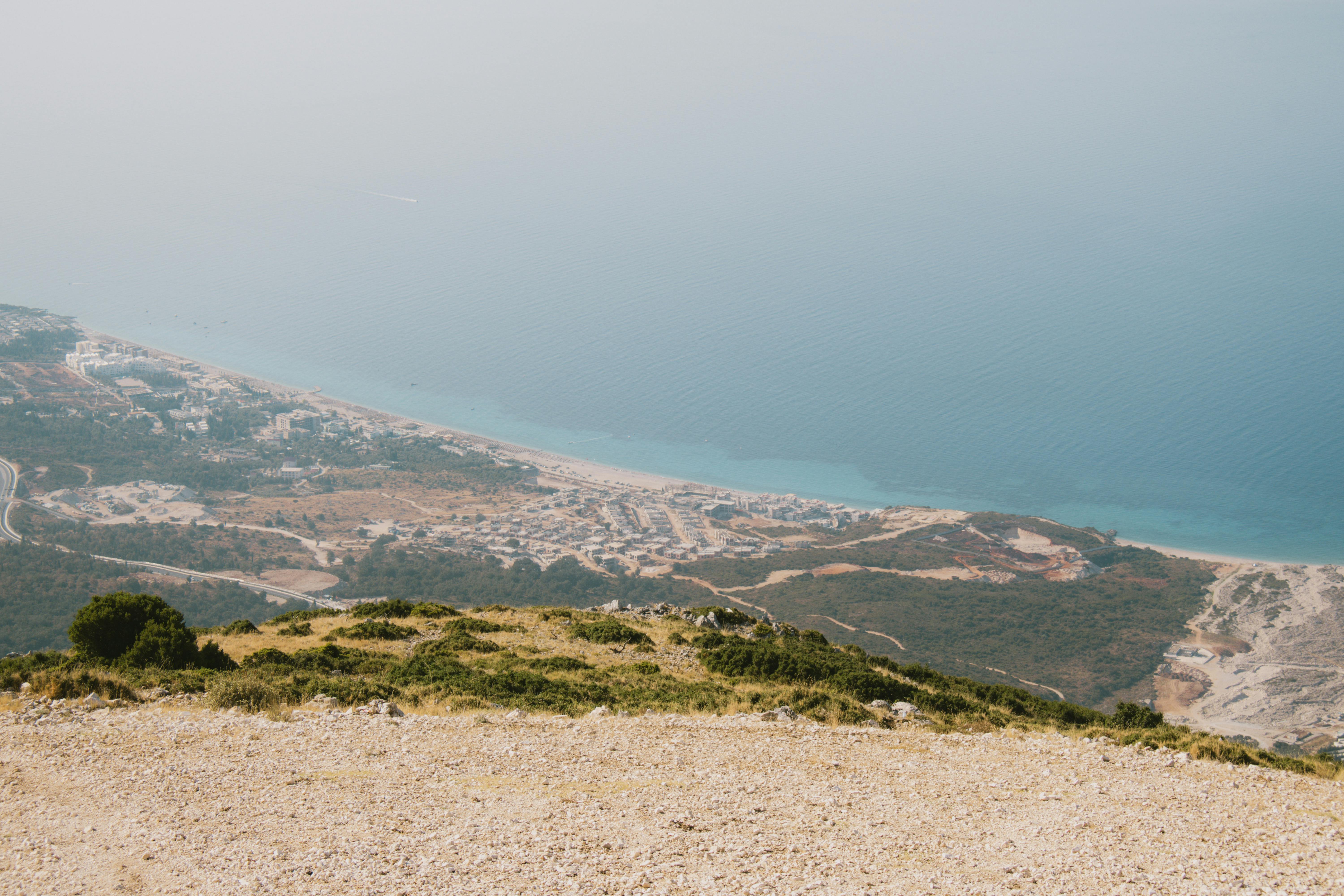 Stunning aerial view of Vlora's coastline in Albania with sandy beaches and turquoise waters.