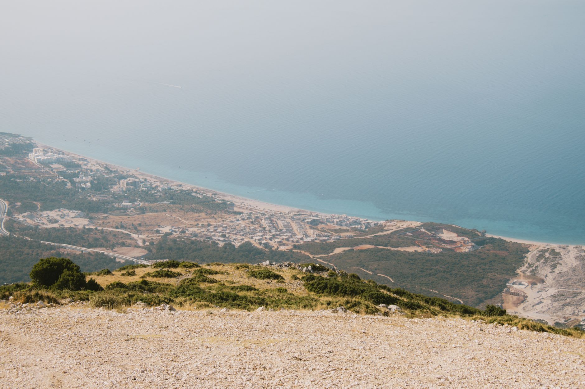 Stunning aerial view of Vlora's coastline in Albania with sandy beaches and turquoise waters.