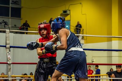 Two boxers clinch in the ring — photo by Franco Monsalvo on Pexels