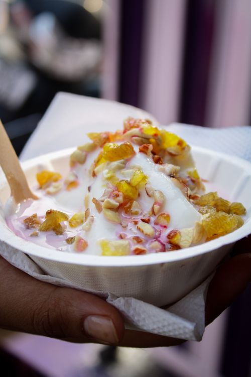 Free Close-up of creamy ice cream topped with colorful fruits in Odisha, India. Stock Photo