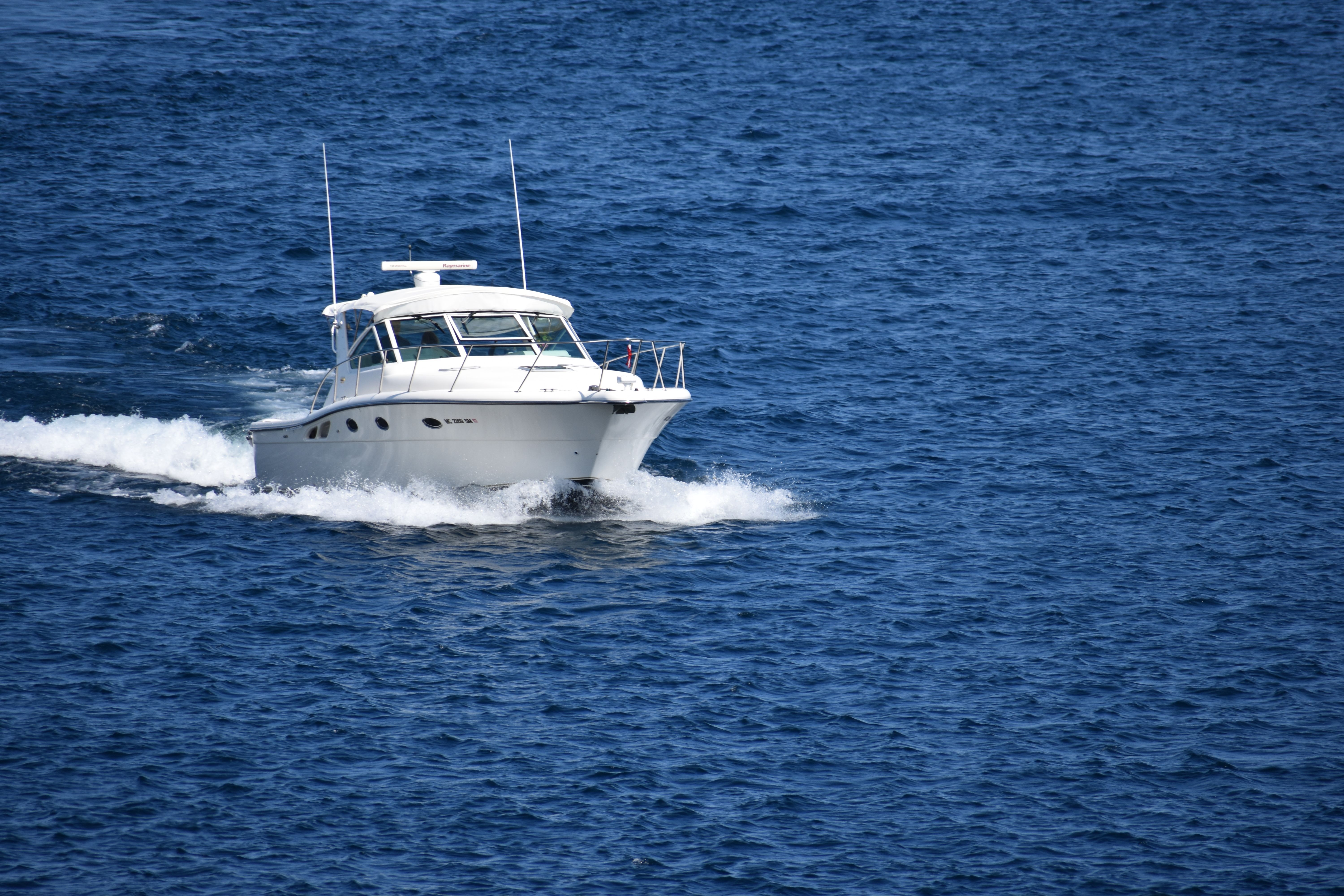 Outstanding Exclusive Waikiki Yacht Snorkel with Lunch and Bevs Review: The Ultimate Oahu Luxury Experience Review 2026 - A sleek white motorboat cruising through the blue waters off Toronto, Ontario, Canada.