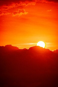 Captivating golden sunset with vibrant clouds over the horizon. Perfect for nature and travel themes.