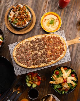 Delicious Middle Eastern spread featuring lahmacun, salads, and dips. Perfect for lunch or dinner.