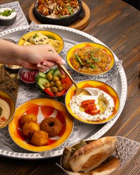 An array of traditional Middle Eastern dishes served on a platter, showcasing vibrant flavors and textures.