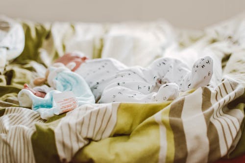 Free Baby In A Bed Stock Photo