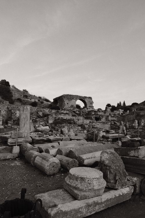 Free Explore the captivating ancient ruins with a stone archway at twilight, embodying historical grandeur. Stock Photo