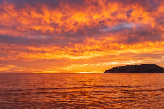 Vibrant sunset over the ocean in Mazatlán, Mexico, beautifully illuminating the sky and sea.