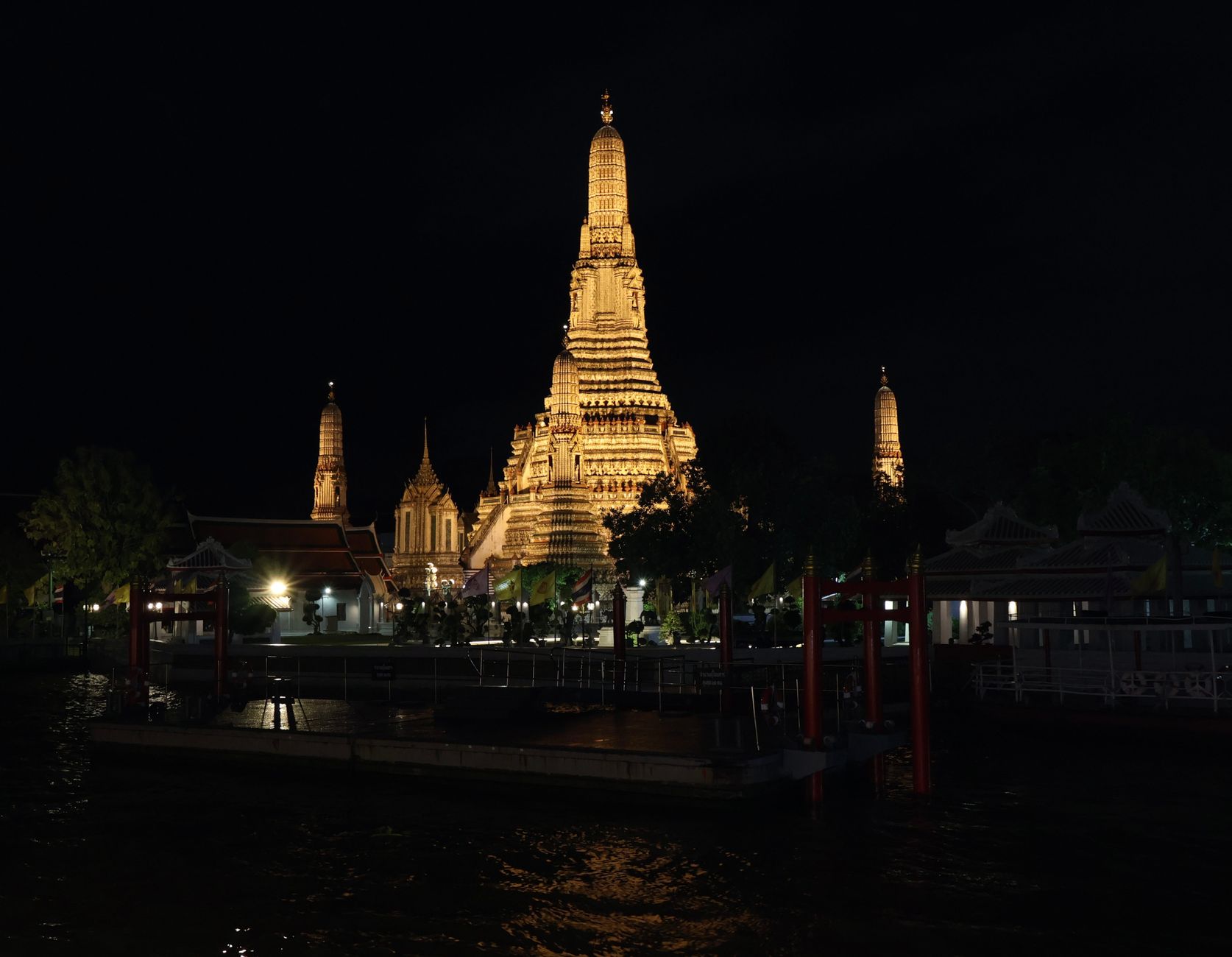 Riverside suite balcony overlooking Wat Arun at sunrise