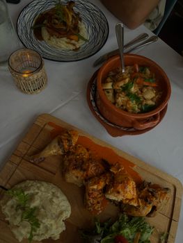 Savor a rustic meal featuring roasted chicken, mashed potatoes, and fresh veggies in Huntsville, ON.