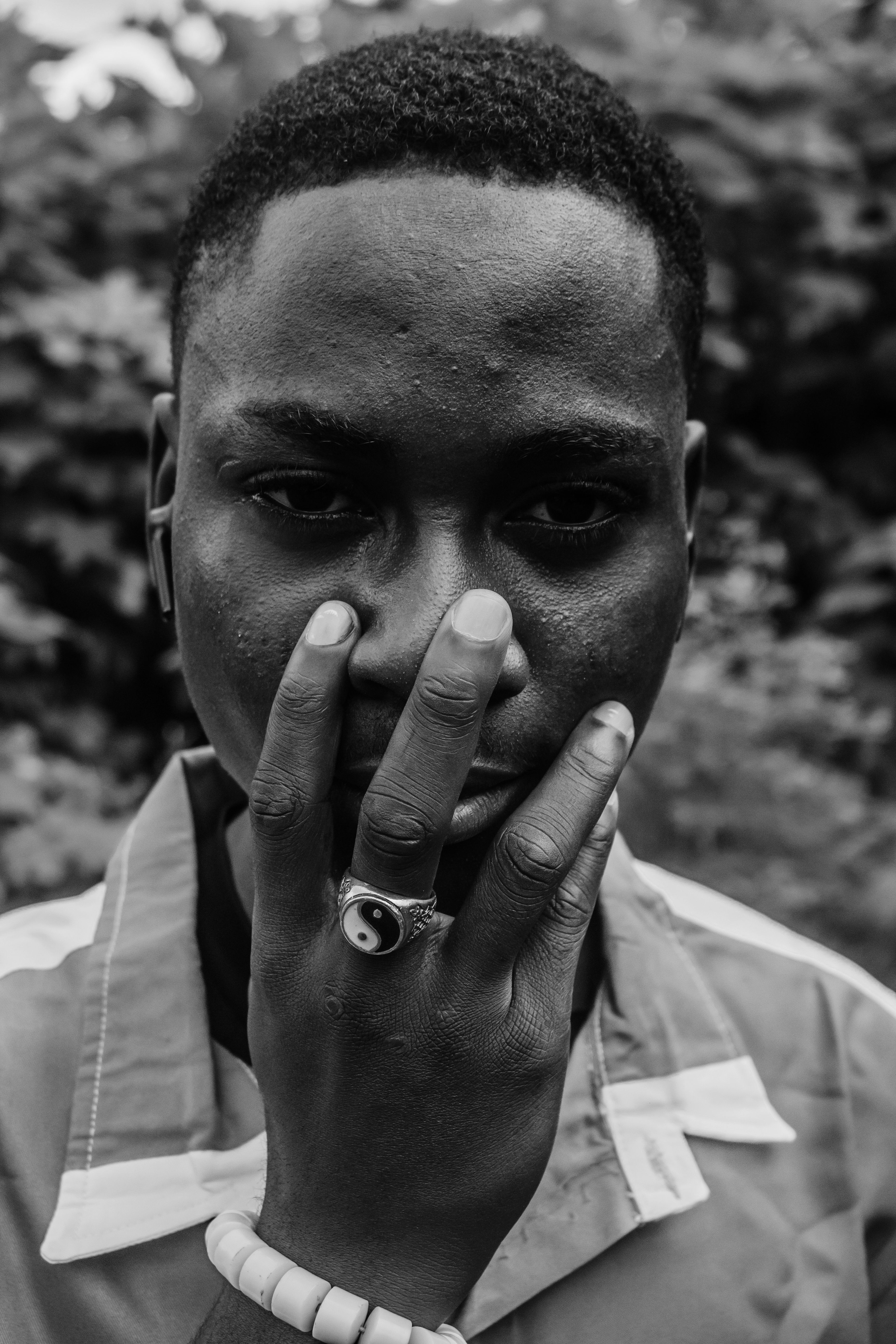 A black and white photo of a man with his hand on his face · Free Stock ...
