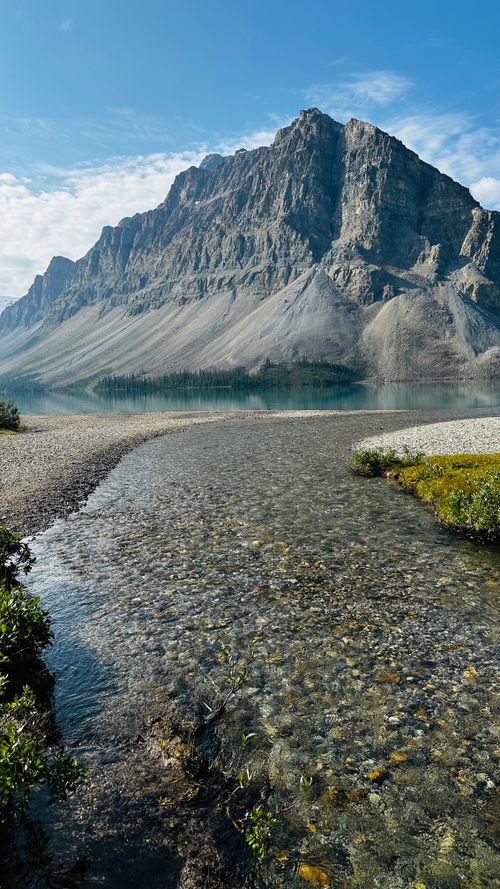 Free A breathtaking mountain landscape with a clear lake under a bright summer sky. Stock Photo