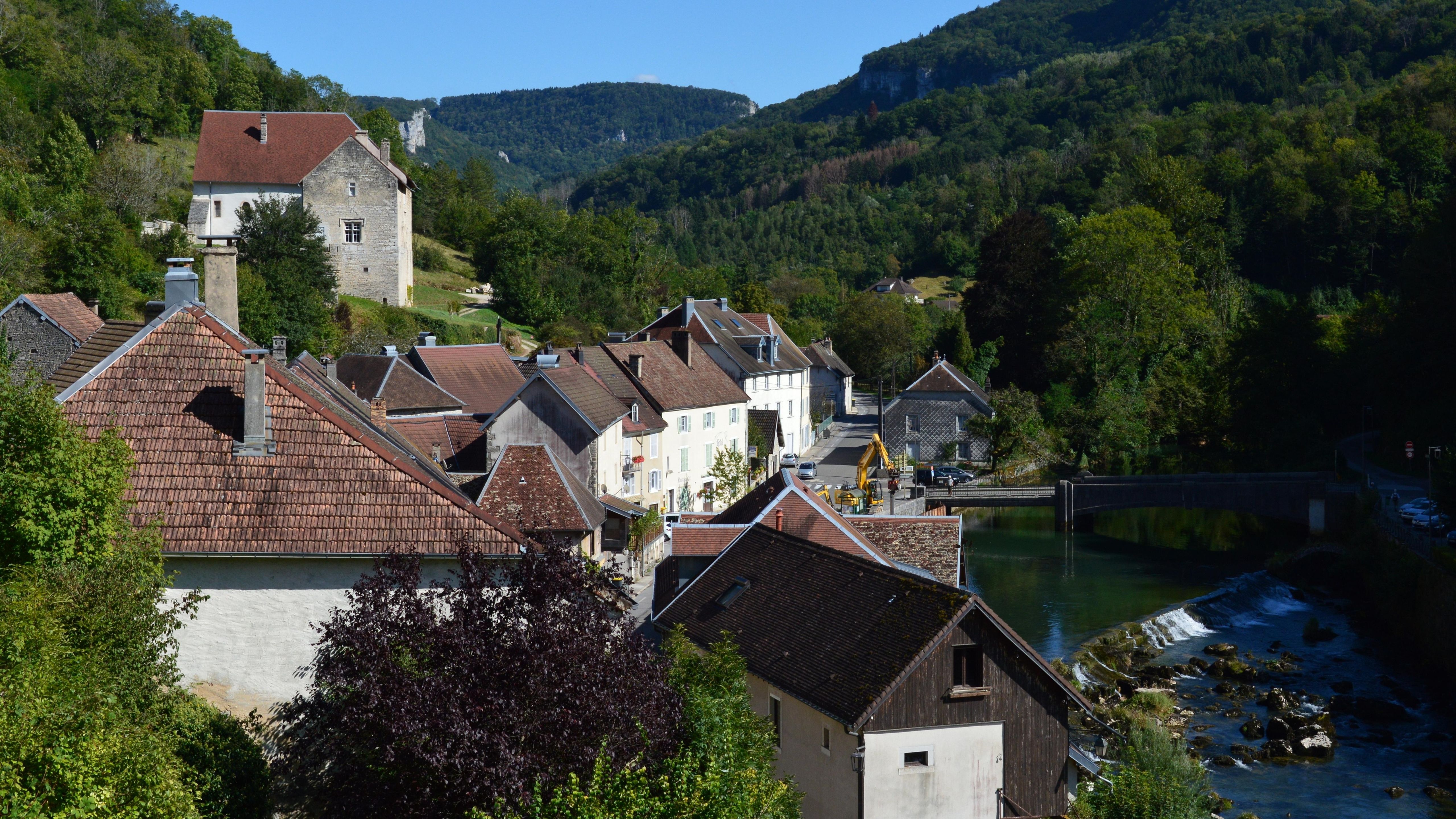Scenic view of the village of Lods, Bourgogne-Franche-Comté, France, by the river.