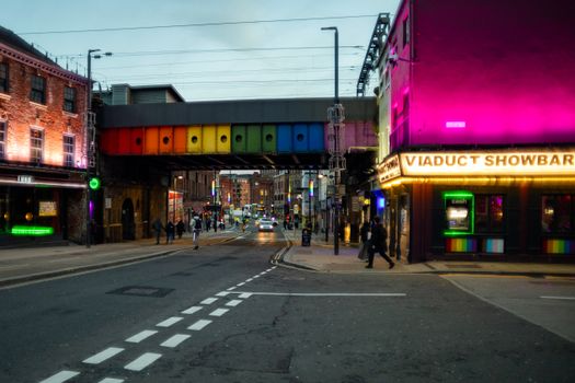 Colorful street with neon lights and nightlife vibes in Leeds, UK.